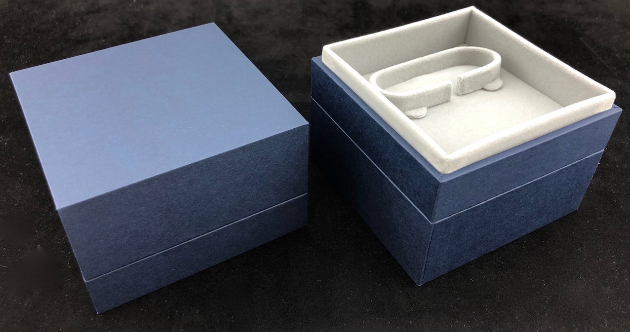 Light Grey suede interior with blue box